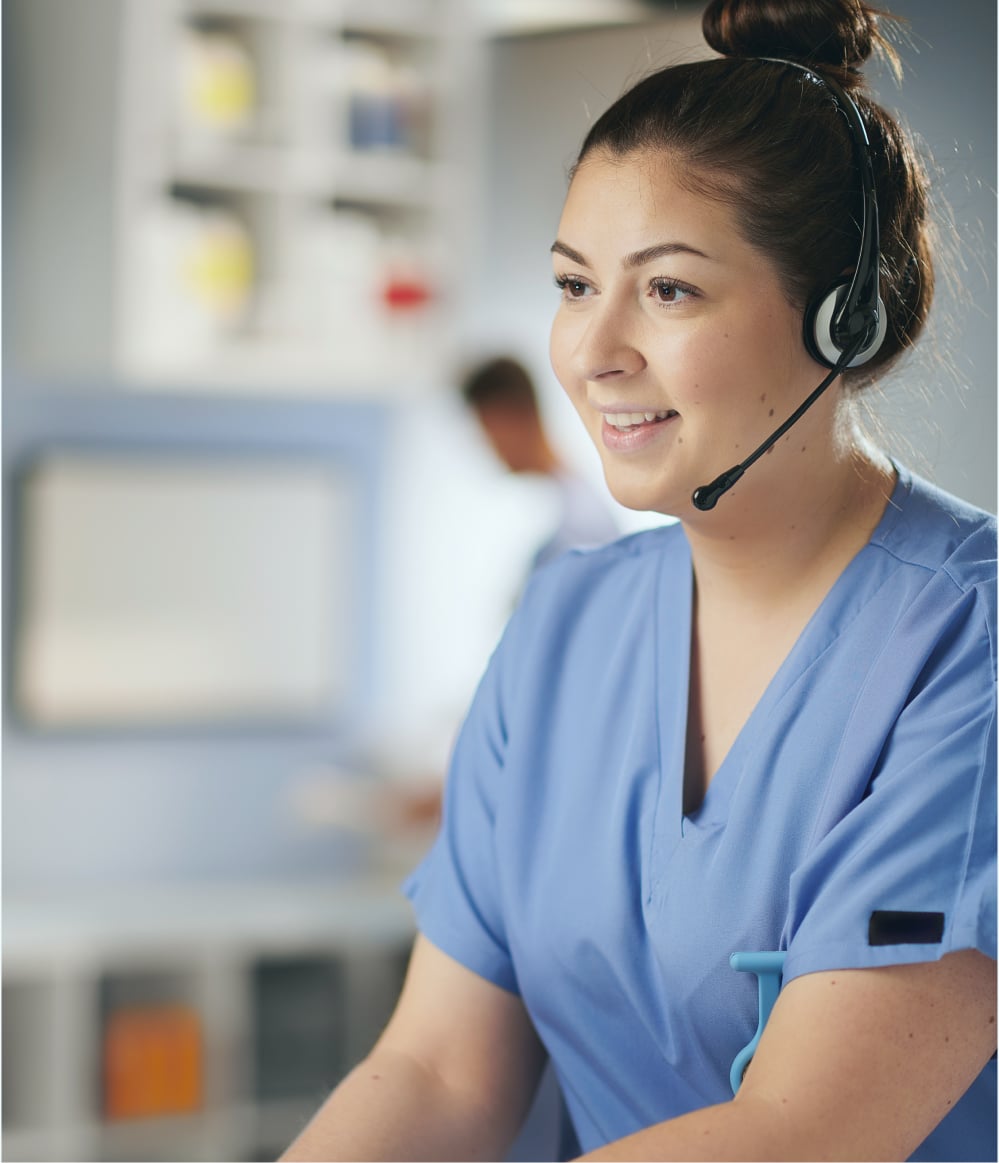 Nurse providing clinical trial call center services with an over-the-head headset.