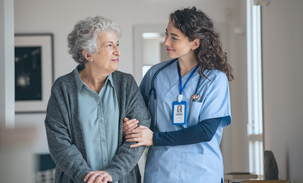 Two women discussing Adherence Support Solutions