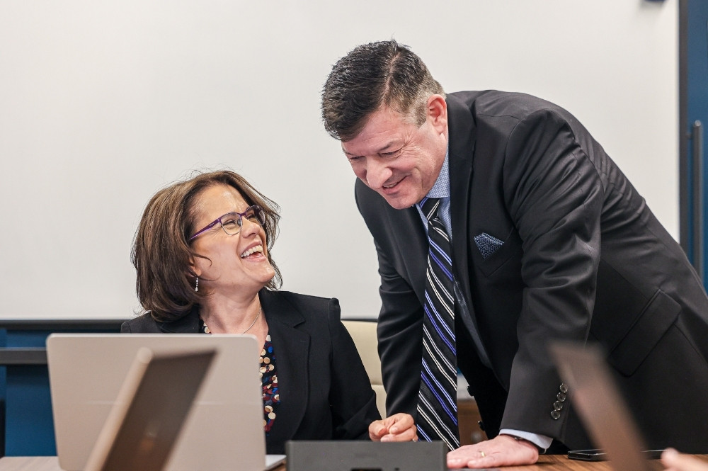 Professionals discussing pharma hub services and patient access support for specialty medications